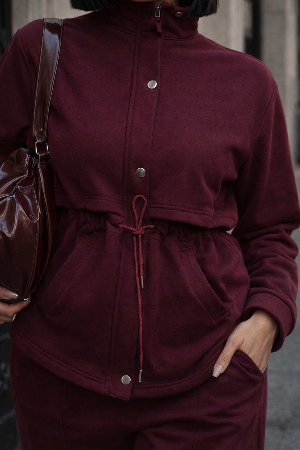 Deep wine two-piece lounge set featuring an adjustable drawstring jacket and relaxed wide-leg pants.